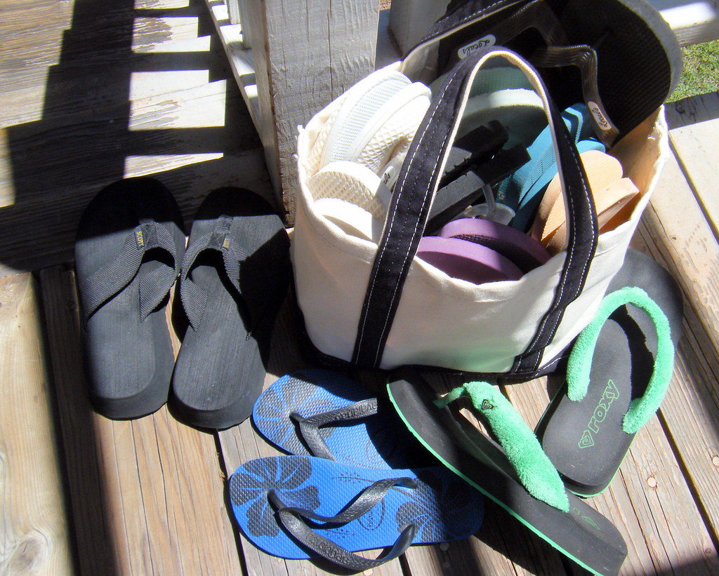 A packed bag with slippers ready for the move